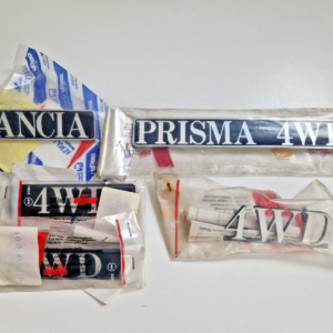 LANCIA PRISMA 4WD SET SCRITTE COMPLETO NOS EMBLEM SET ORIGINAL