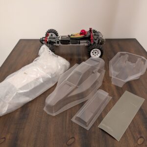 Buggy Kyosho Optima KYO30617B escala 1/10 4x4 con 2 carrocerías y soportes Optima Pro-
